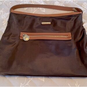 Two tone Brown and tan Michael Kors shoulder purse.